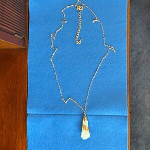 Elegant Necklace with Green stone overlaid with gold.